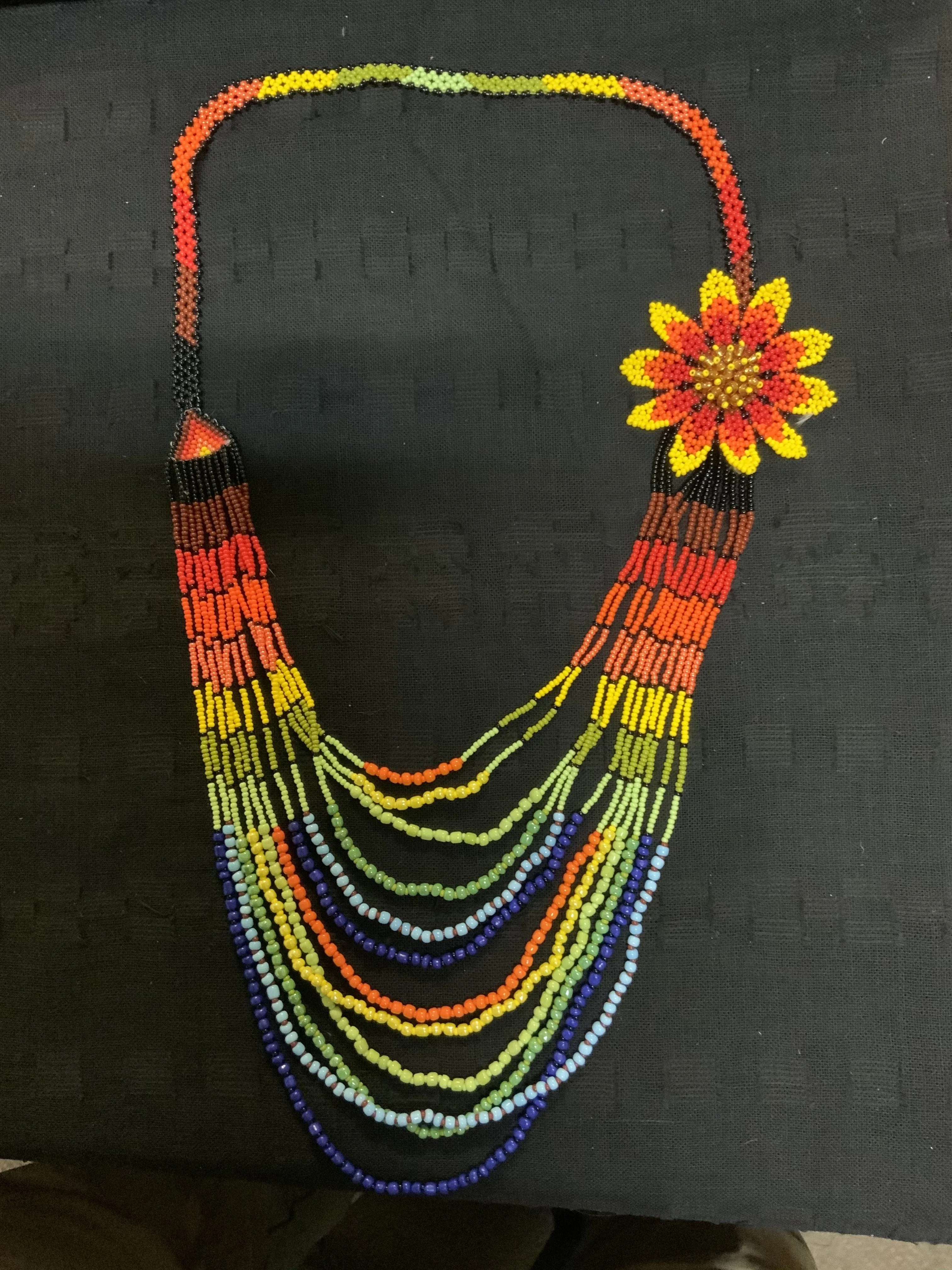 Guatemalan handcrafted glass bead bib style necklace. 24” neck, total length 36”.